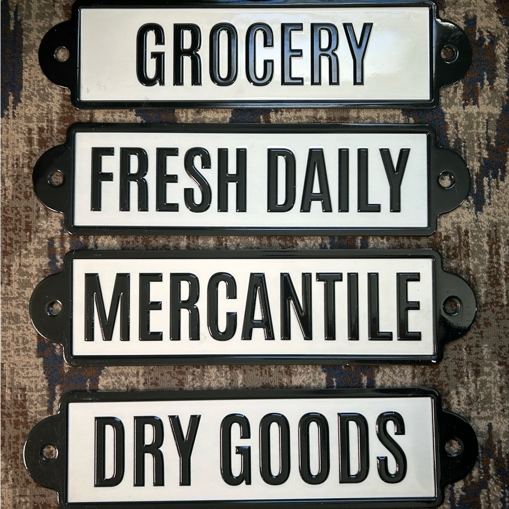 Four Metal Signs